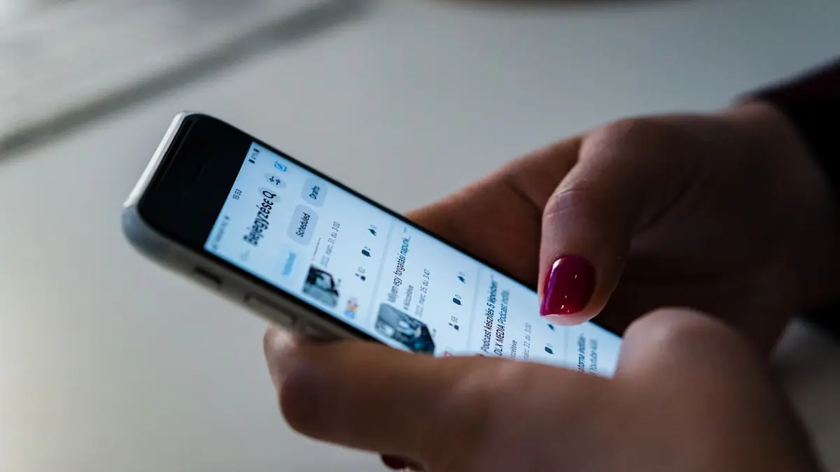 A person browsing social media on a smartphone